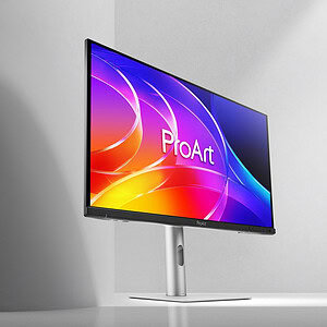 ProArt OLED monitor met kleurrijk scherm en zilveren standaard op bureau.